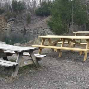 Here's one of the old tables (left) next to some of the new tables (right).<br />Not only are the new tables larger, but they are also sturdier.